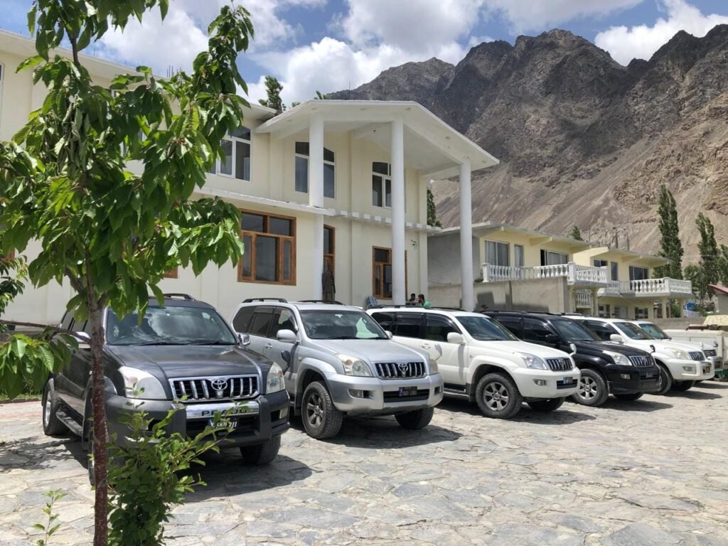 Row of luxury Toyota Prado SUVs parked outside a northerndiscover.com managed hotel accommodation in Skardu, Gilgit-Baltistan.
