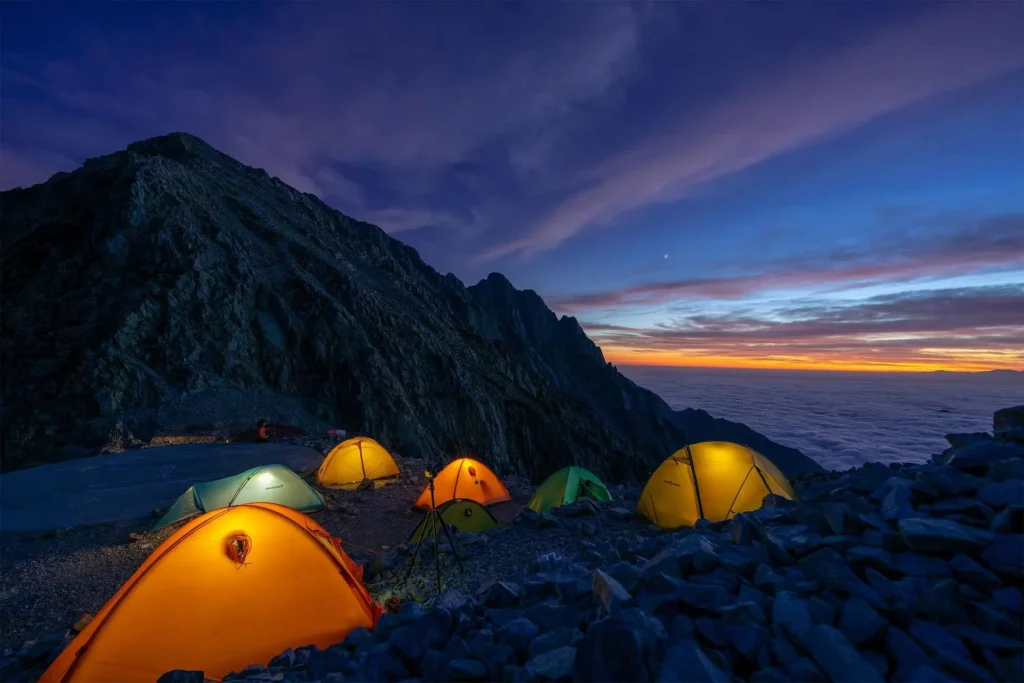 Urdukas campsite with tents on rocky terrain at 4050m K2 Base Camp trek Pakistan