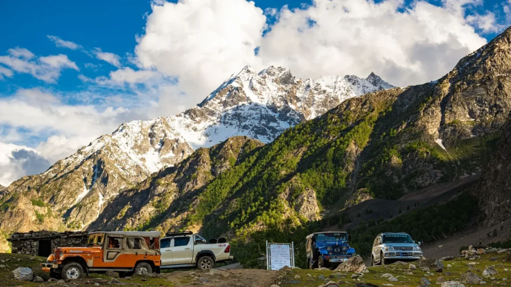Best Time to Visit Fairy Meadows | Month-by-Month Guide 1 Best time to visit Fairy Meadows with a scenic view of Nanga Parbat and jeeps